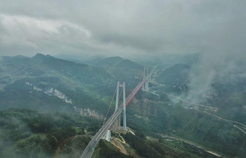 Fog-shrouded Qingshuihe bridge in southwest China's Guizhou
